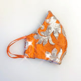 orange and gold sequin face mask